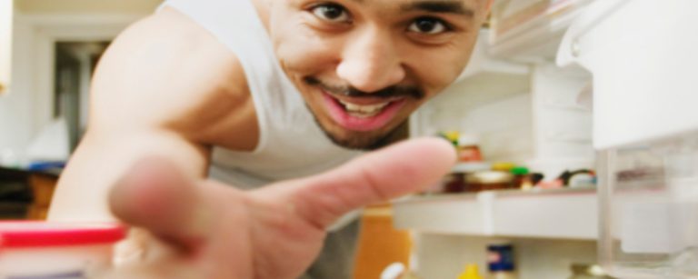 Smart refrigerator with interior cameras, organized shelves and labeled containers of fresh produce