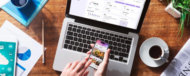 Professional nutritionist using apps for nutritionists on tablet to create meal plans for clients"